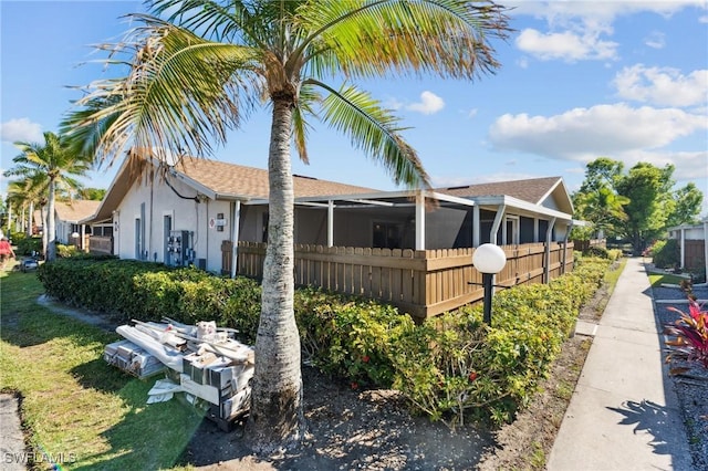 view of property exterior featuring fence and stucco siding