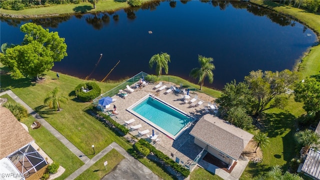 birds eye view of property with a water view