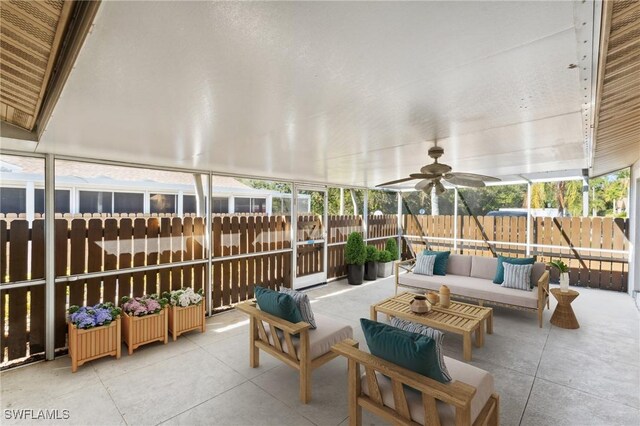 sunroom with a ceiling fan