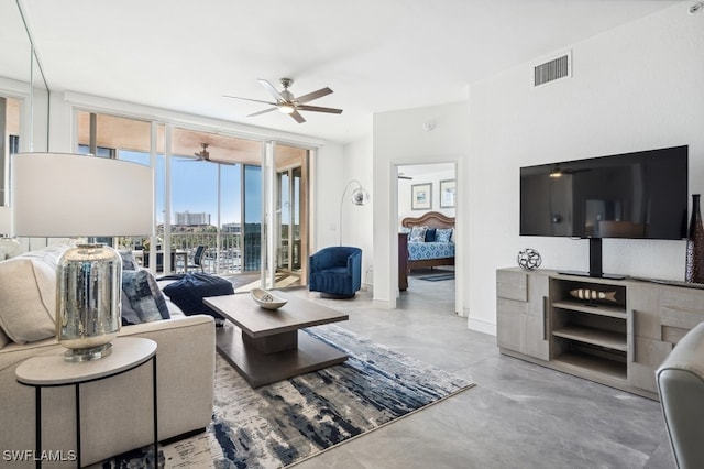 living room featuring floor to ceiling windows