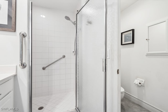 bathroom with vanity, toilet, and an enclosed shower