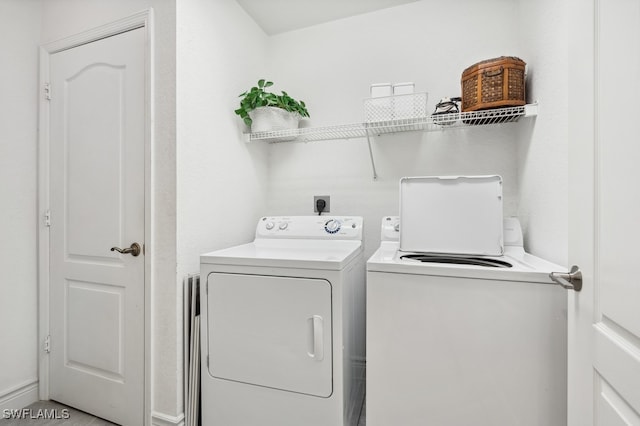 laundry room with washing machine and clothes dryer