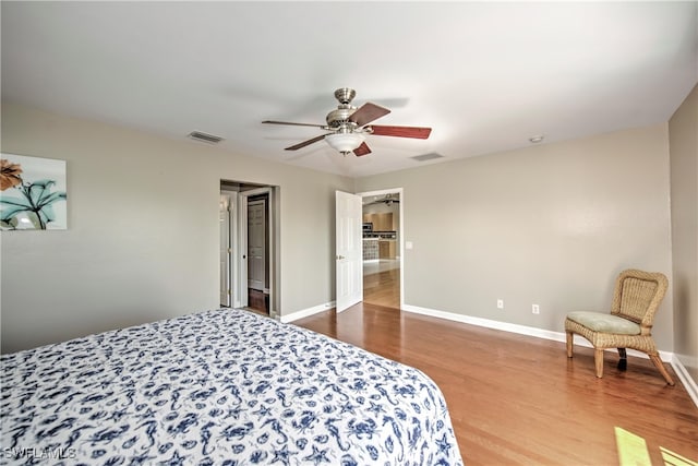 bedroom featuring hardwood / wood-style floors and ceiling fan