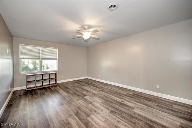 unfurnished room featuring ceiling fan and dark hardwood / wood-style floors