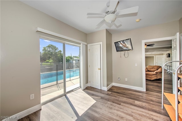 interior space featuring ceiling fan and hardwood / wood-style flooring