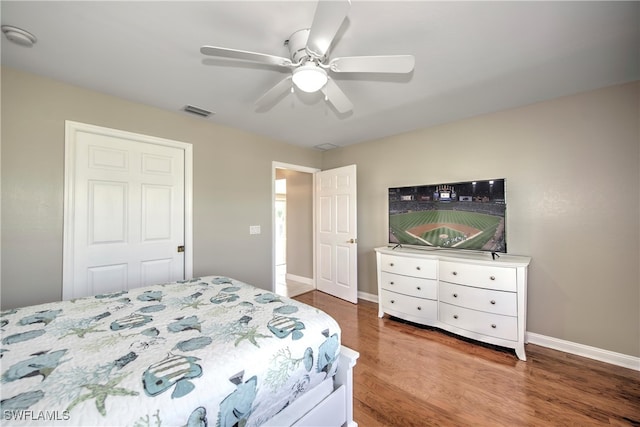 bedroom featuring hardwood / wood-style floors and ceiling fan