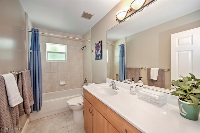 full bathroom with tile patterned floors, vanity, shower / bath combo, and toilet