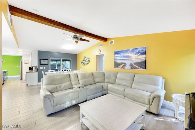 living room with lofted ceiling with beams, light hardwood / wood-style floors, and ceiling fan