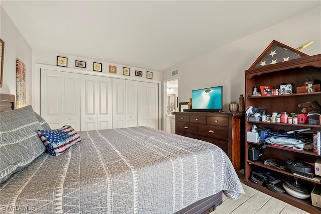 bedroom featuring a closet and light wood-type flooring