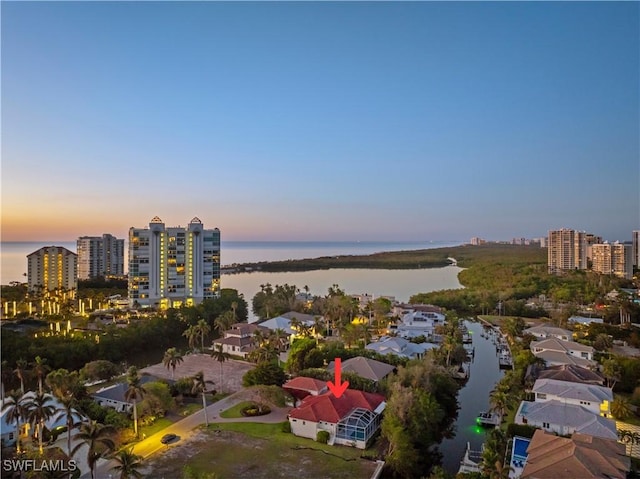 aerial view at dusk with a water view