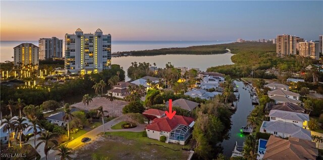 aerial view at dusk with a water view