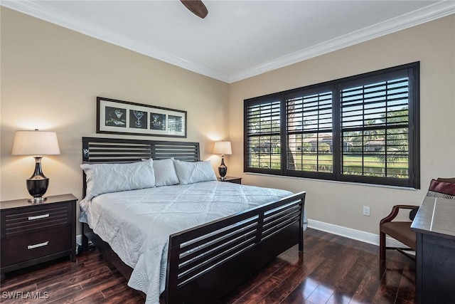 bedroom with ornamental molding, a ceiling fan, baseboards, and dark wood-style flooring