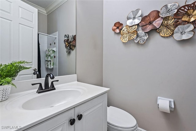 bathroom with a shower, toilet, ornamental molding, and vanity