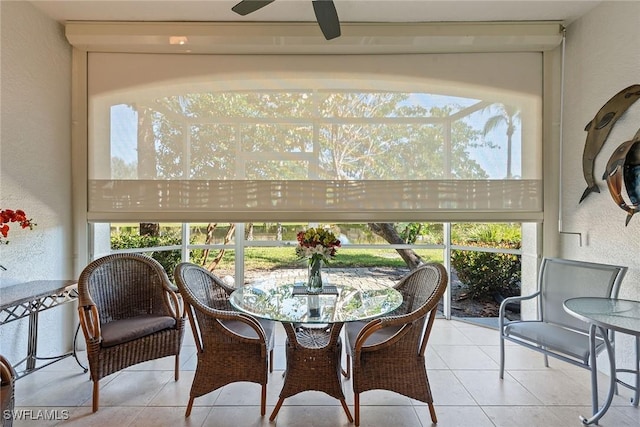 sunroom featuring ceiling fan