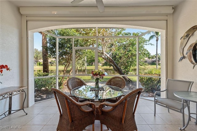 sunroom featuring beamed ceiling