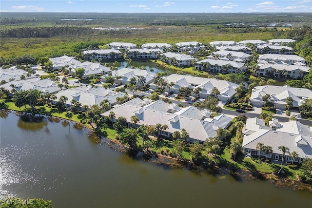 bird's eye view featuring a residential view and a water view