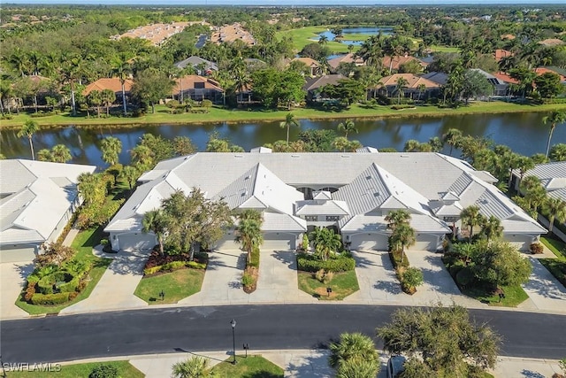 bird's eye view with a residential view and a water view