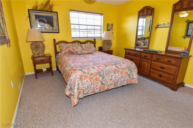 bedroom with light colored carpet