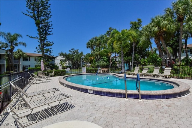 view of swimming pool with a patio area