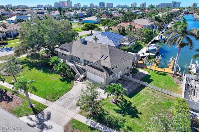 birds eye view of property featuring a water view