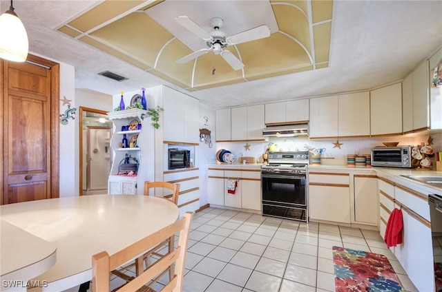 kitchen with ceiling fan, hanging light fixtures, white cabinets, light tile patterned flooring, and range