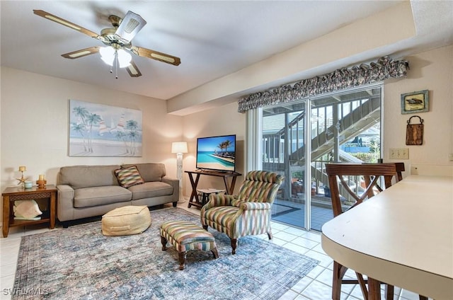 living room with ceiling fan and light tile patterned flooring