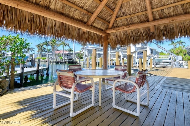 dock area with a gazebo and a water view