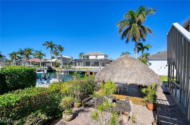 view of yard with a gazebo and a water view