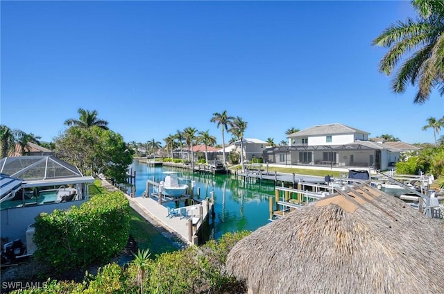 dock area with a water view and a lanai