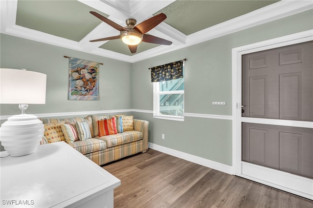 living room with ceiling fan, ornamental molding, and hardwood / wood-style flooring