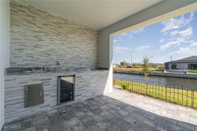 view of patio featuring a water view