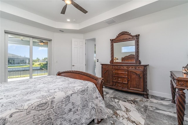 bedroom featuring access to exterior, a water view, and ceiling fan