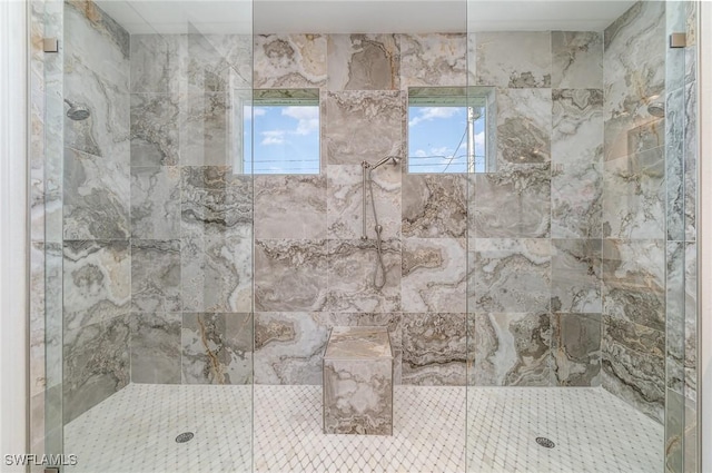 bathroom featuring a tile shower