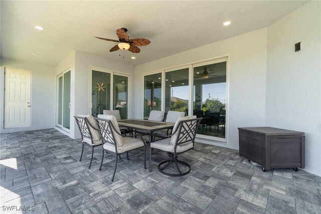 view of patio featuring ceiling fan