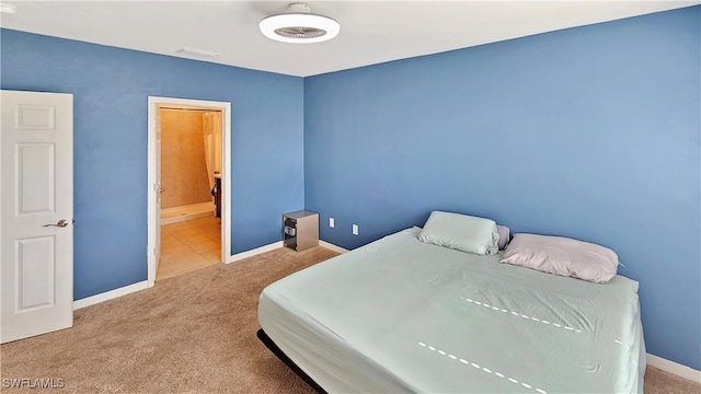 bedroom with light carpet