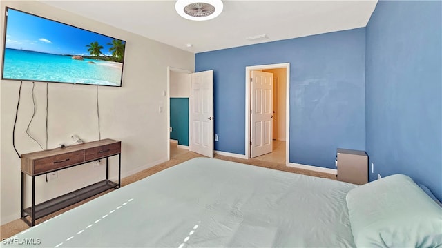 bedroom with light carpet