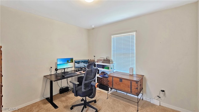 home office featuring a healthy amount of sunlight and light colored carpet