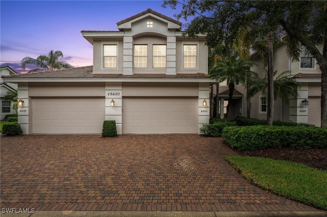 front of property with a garage