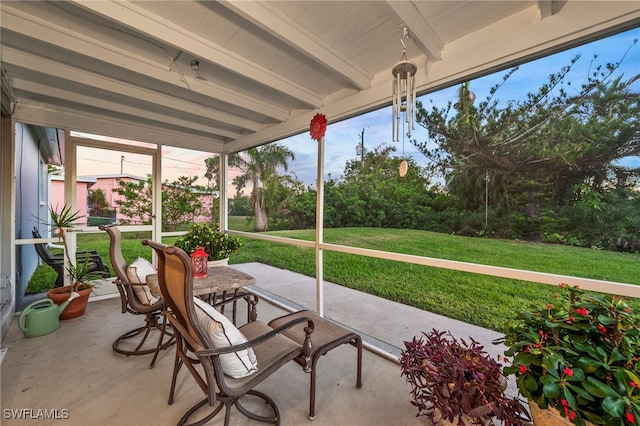 sunroom / solarium with beamed ceiling