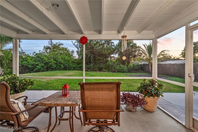 sunroom with beamed ceiling