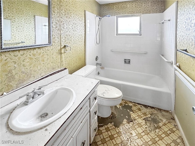 full bathroom with vanity, toilet, and tiled shower / bath