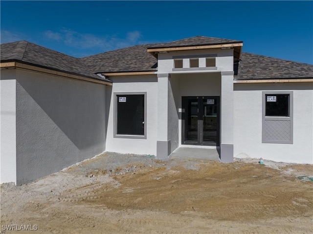 property entrance featuring french doors