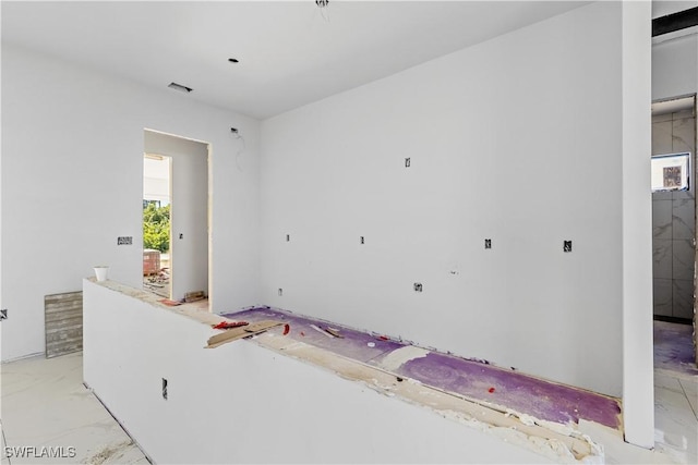 unfurnished bedroom featuring multiple windows