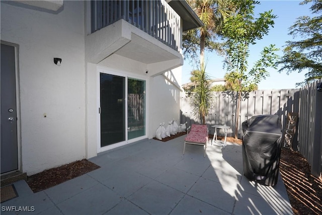 view of patio / terrace with a balcony and area for grilling