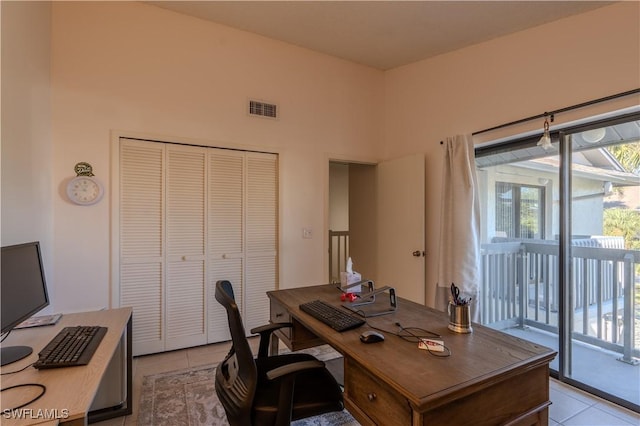 office area with light tile patterned floors