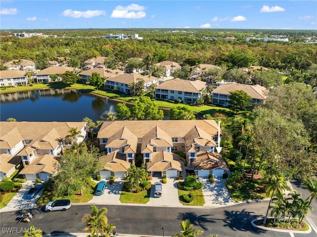 birds eye view of property featuring a water view and a residential view