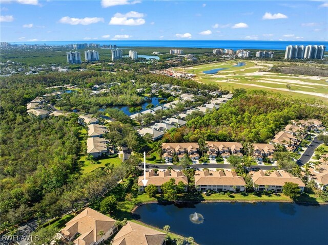 drone / aerial view with a water view and a residential view