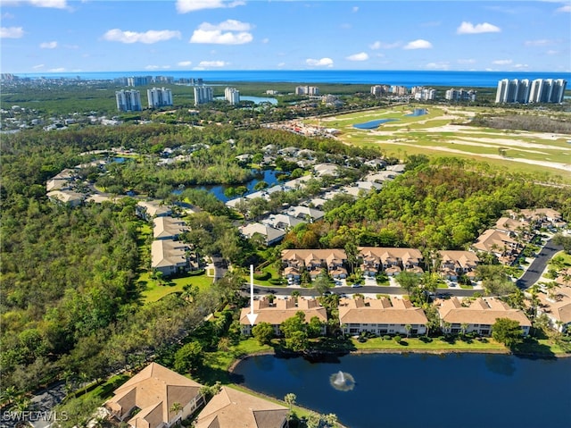 birds eye view of property with a water view and a residential view