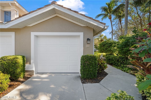 garage featuring driveway