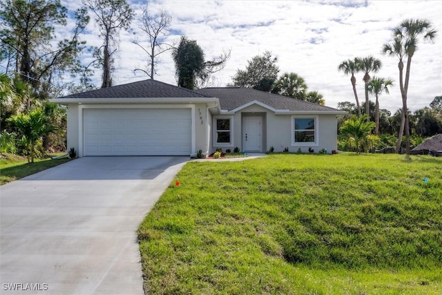 ranch-style house with a garage and a front lawn